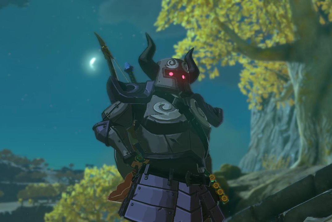 Link stands on a sky island wearing the Phantom Armor at night, with the moon right next to him in Zelda: Tears of the Kingdom