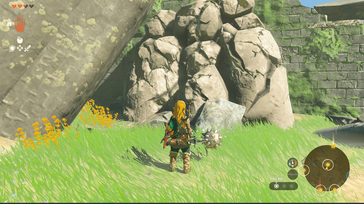 Link shatters a boulder blocking a path in Zelda Tears of the Kingdom.