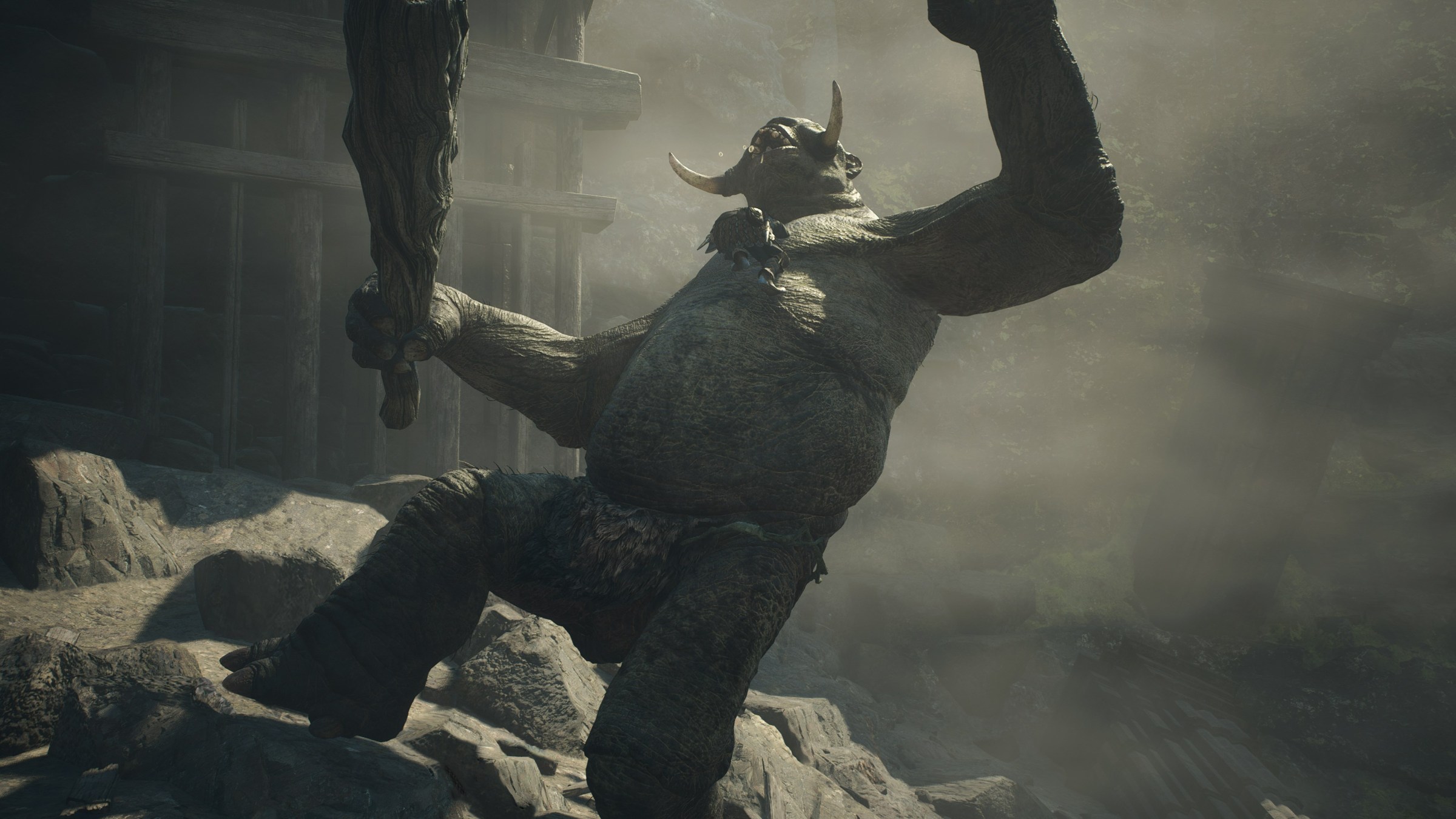 An Arisen wrestles a cyclops to the ground in Dragon’s Dogma 2