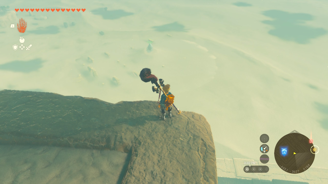 Link standing on the top of the Lightning Temple in Zelda: TOTK, looking down at a shrine