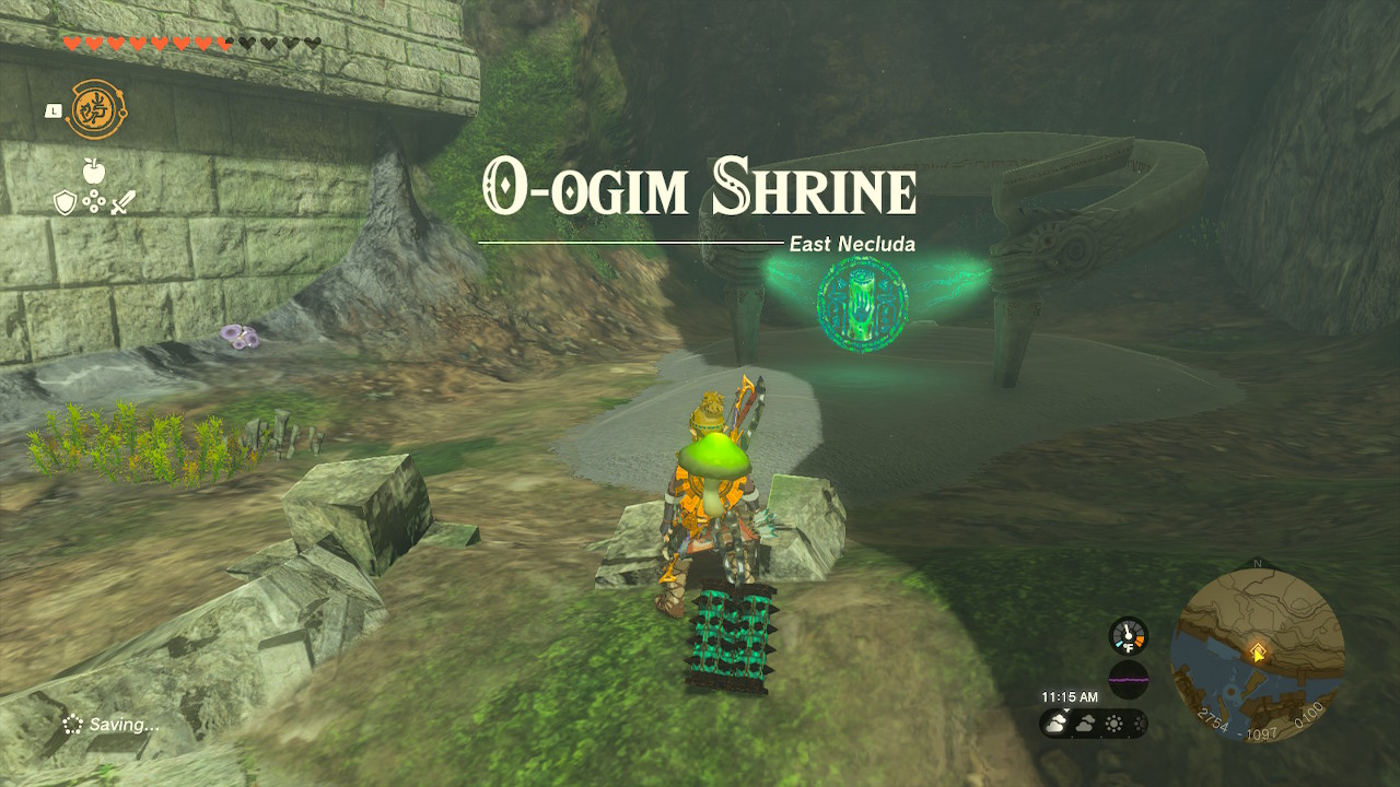 The words O-ogim Shrine (East Necluda) are on the screen in front of the shrine area, unoponed.