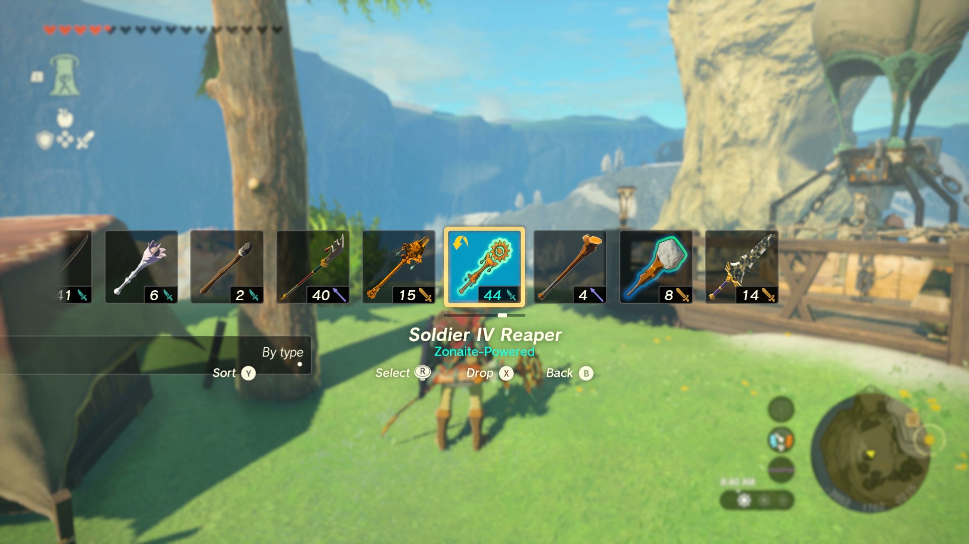 The quick select weapon screen in Tears of the Kingdom, showing a Soldier IV Reaper, as well as some decayed weapons and a long stick