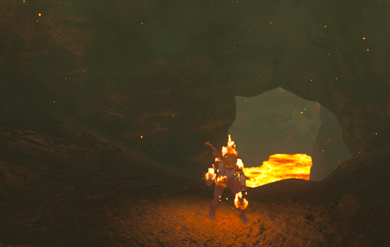 Link wearing the Sheikah armor in a lava-filled cave, burning to a slow and painful death in Tears of the Kingdom