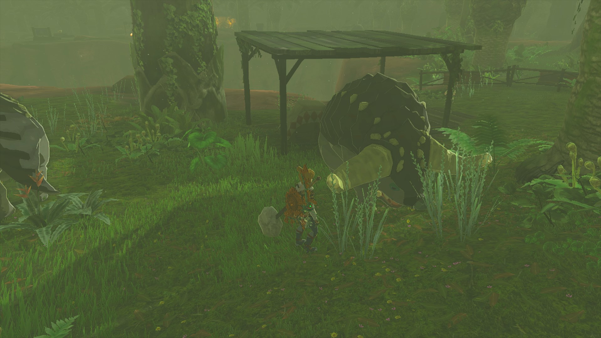 A dondon in Tears of the Kingdom crunches on some luminous stone in Akkala.