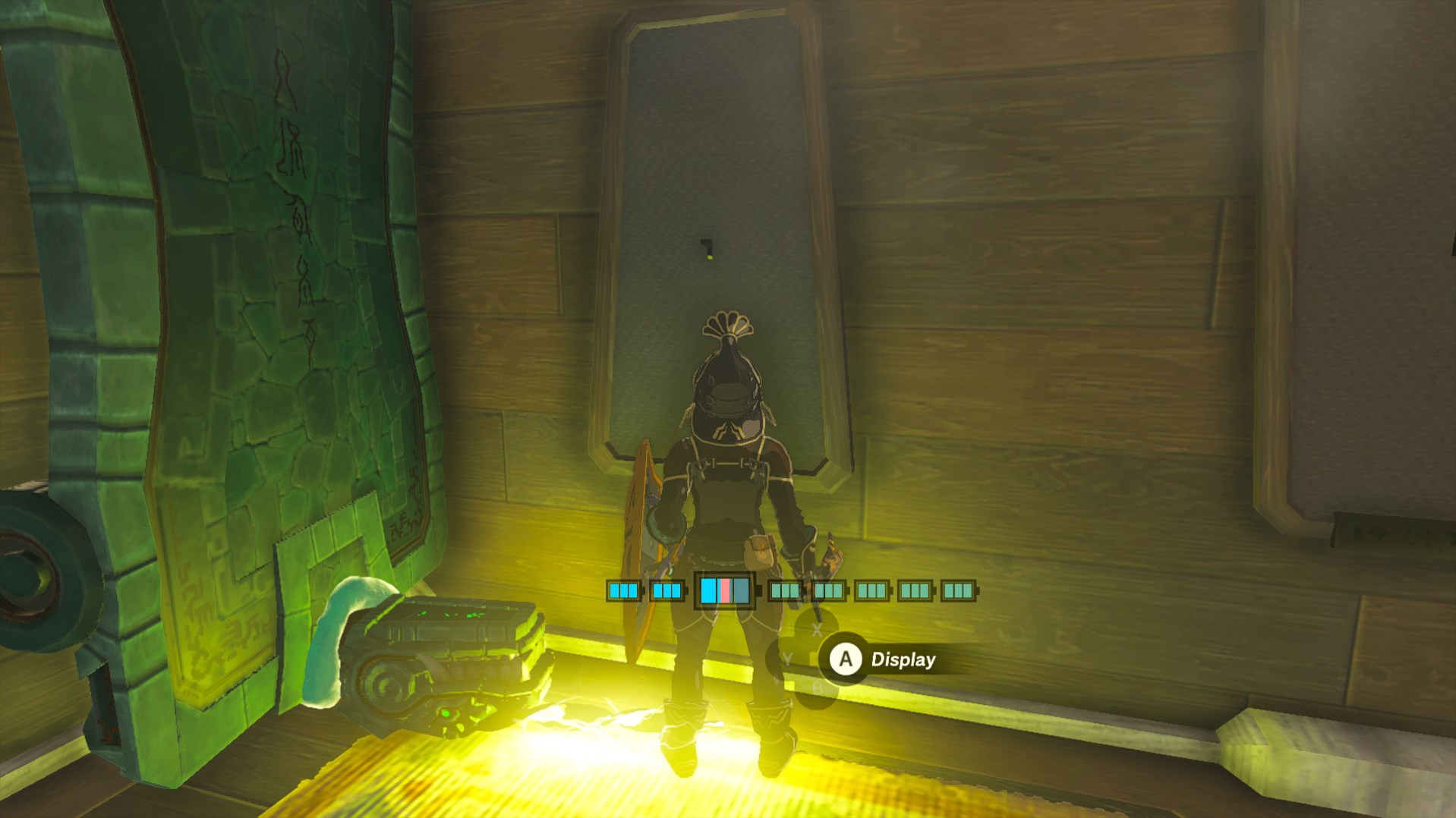 Link stands in front of a bow display case as a shock emitter hits his feet in Tears of the Kingdom. Since he’s in the rubber armor, it doesn’t matter.