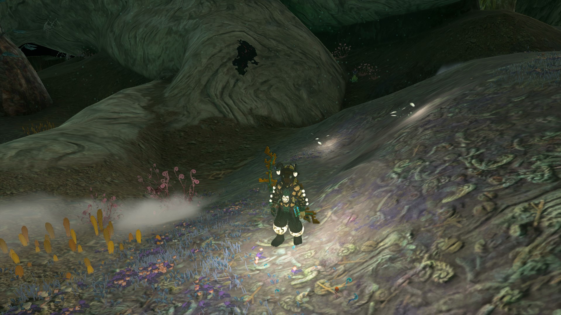 Link in the Tears of the Kingdoms Depths in the Miner’s Armor with several small puddles of light around him.