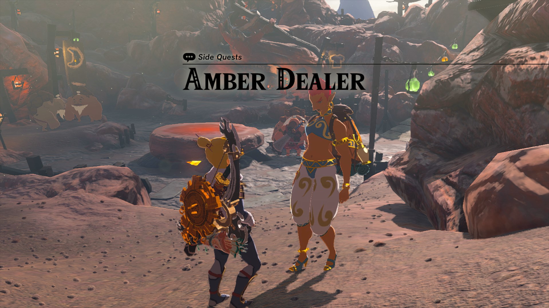 Ramella, a Gerudo woman, in Tears of the Kingdom, talks to Link in Goron City with the text “Amber Dealer” above them.