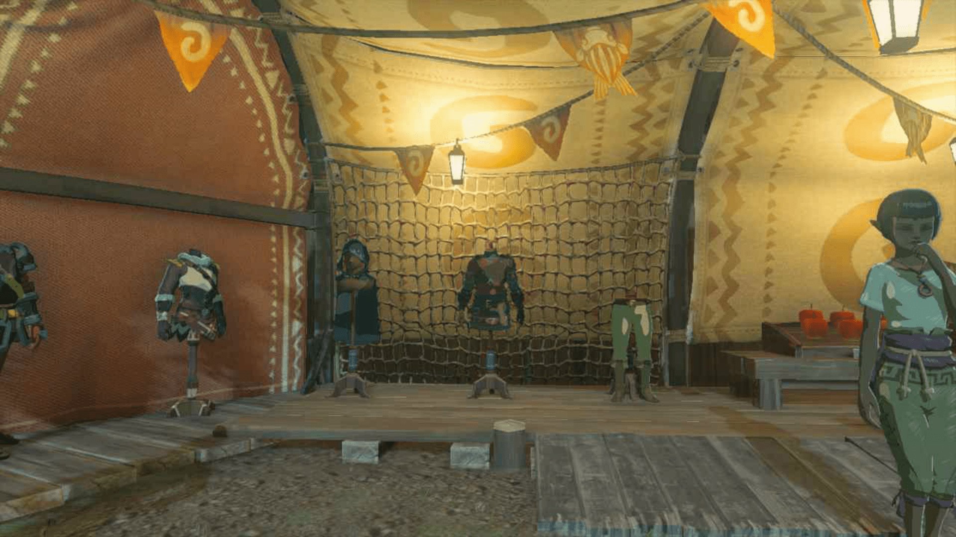 An image of the Hylian Armor set in The Legend of Zelda: Tears of the Kingdom. The clothes are sitting on mannequins in an open market square stall.