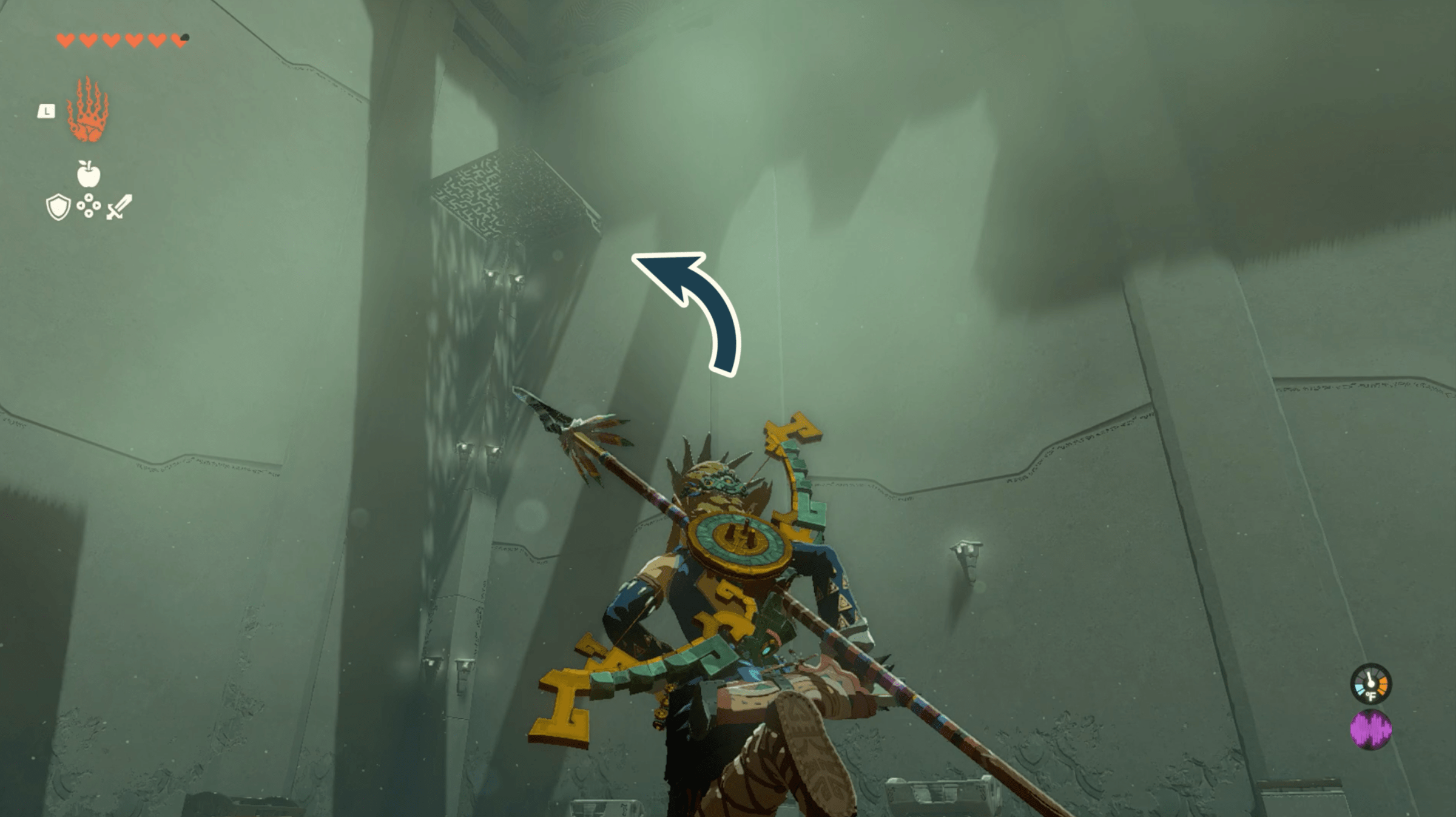 An image of the upper level in Oromuwak Shrine. The graphic points to a platform that has a chest on it in the corner of the room.
