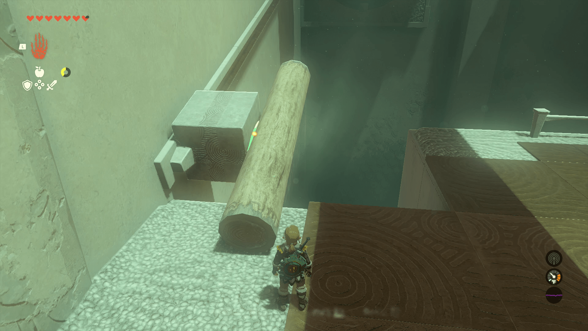 Link has used Ultrahand to glue a log to a stone on the wall that’s on a slider as part of a puzzle in Oshozan-u Shrine