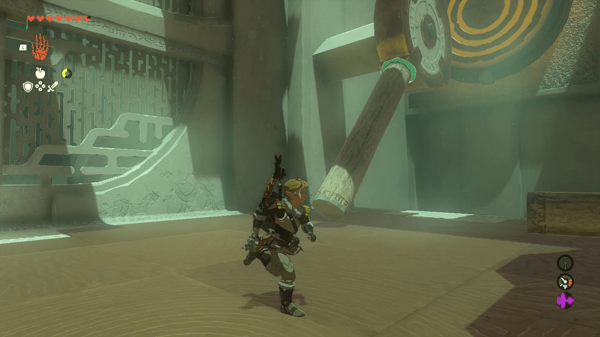 After Link uses Ultrahand to attach a log to a gear in Oshozan-u Shrine, the gear rotates downward, accommodating the weight of the log