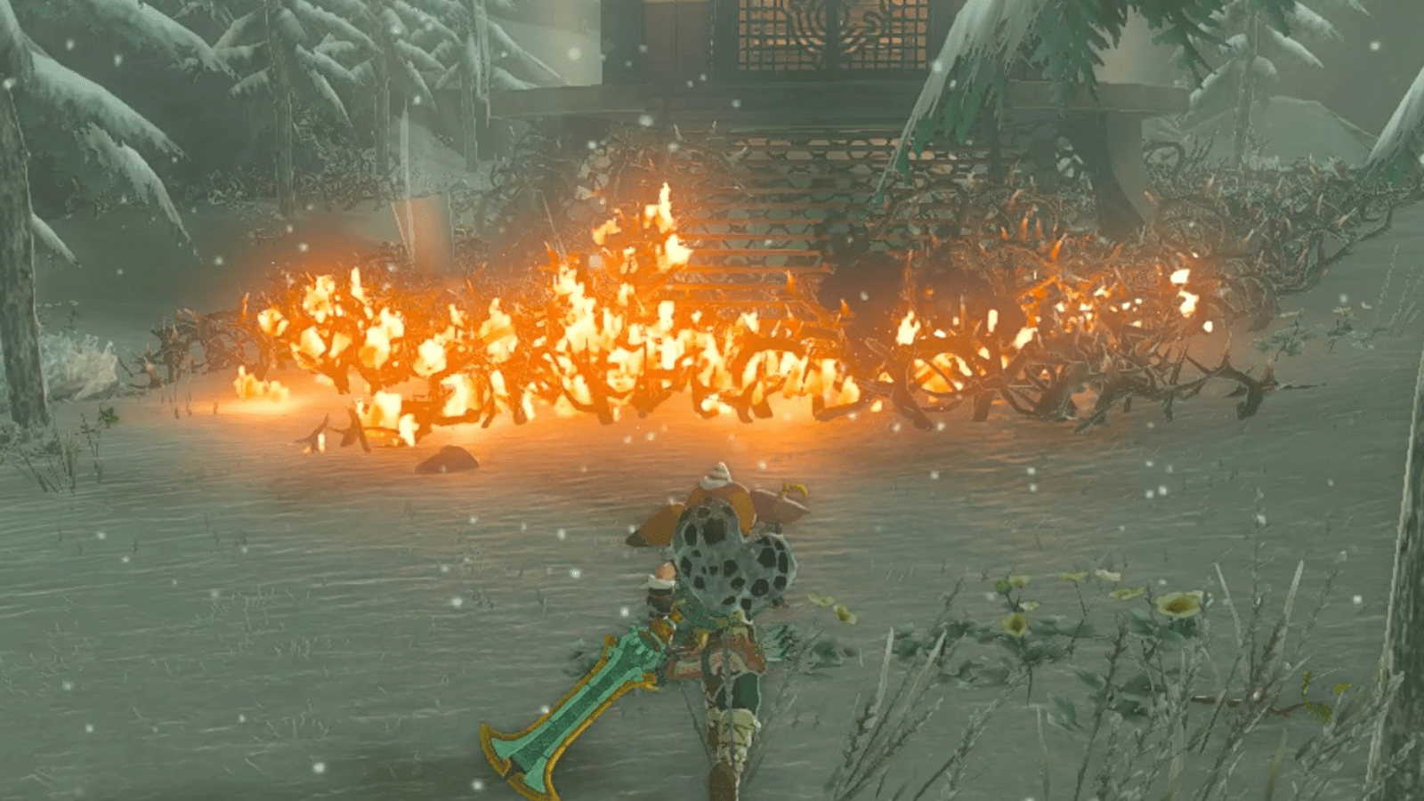Link runs towards Rospro Pass Skyview Tower, which is surrounded in thorns set ablaze in The Legend of Zelda: Tears of the Kingdom