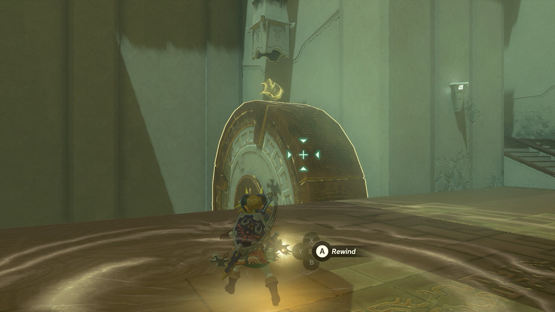 Link using Recall on a large stone wheel to retrieve a chest in the Tauyosipun Shrine in The Legend of Zelda: Tears of the Kingdom.