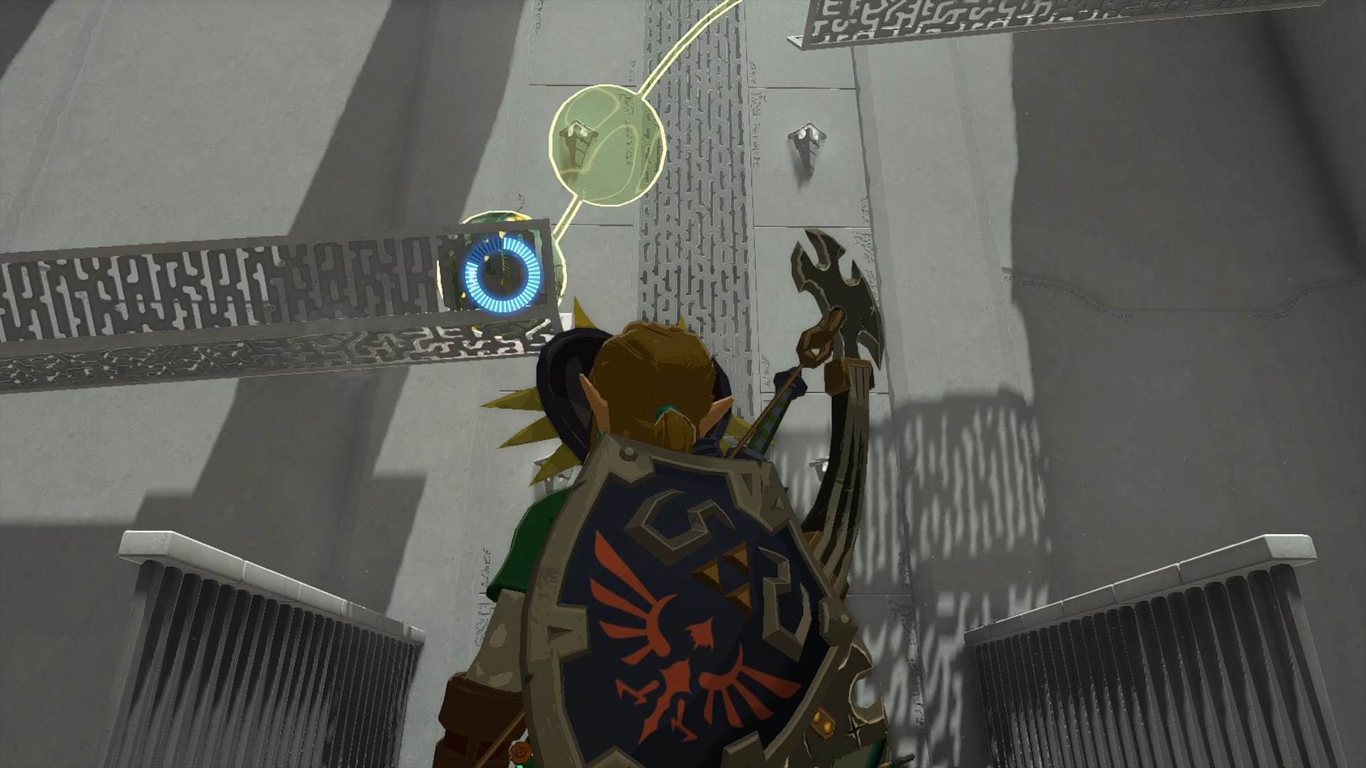 Link using Recall on a stone ball while wearing the Hylian shield and Majora’s Mask in the Tauyosipun Shrine in The Legend of Zelda: Tears of the Kingdom.