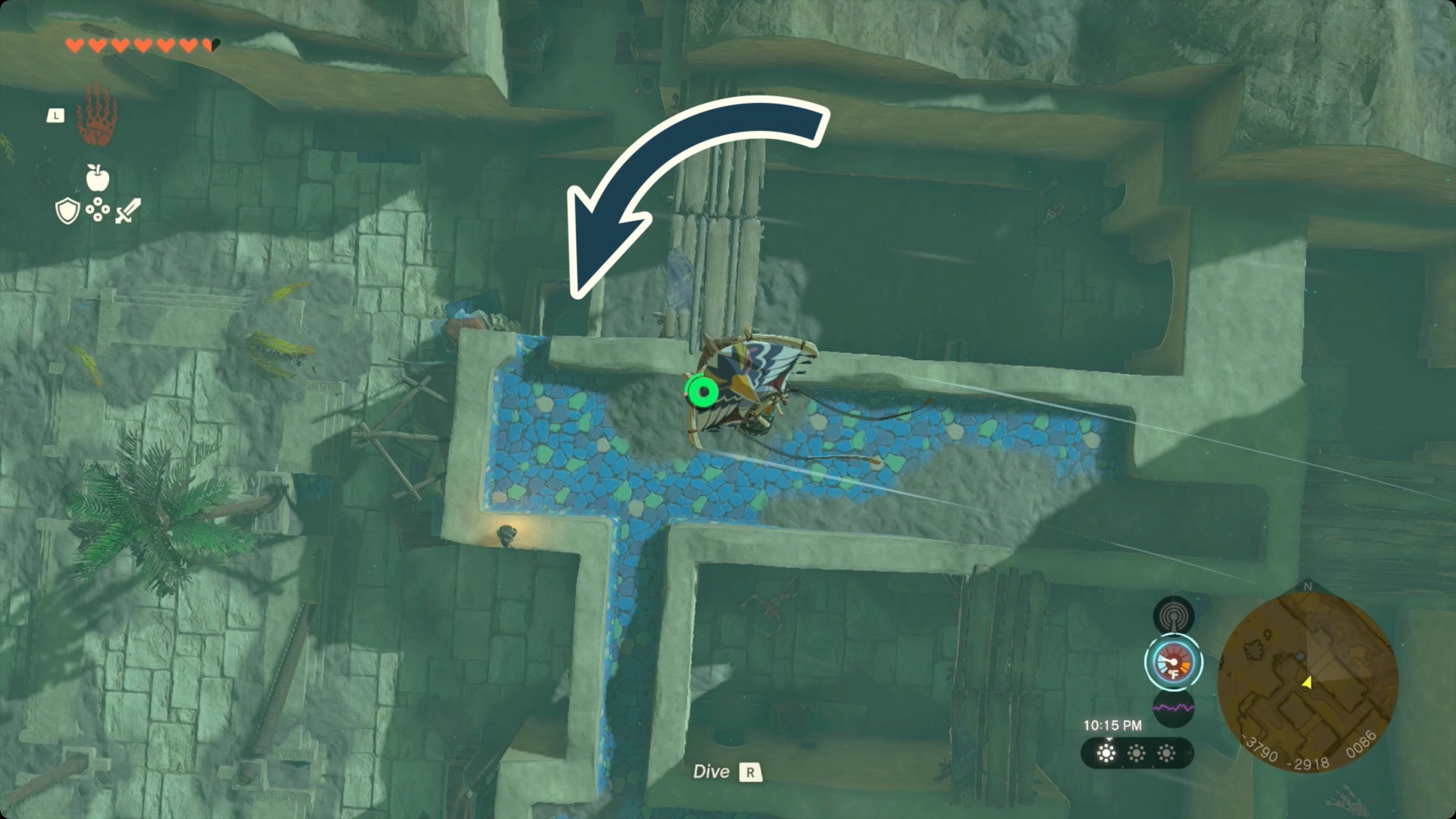 The Legend of Zelda: Tears of the Kingdom Link paragliding over Gerudo Town with the entrance to the cave below Fashion Passion marked.