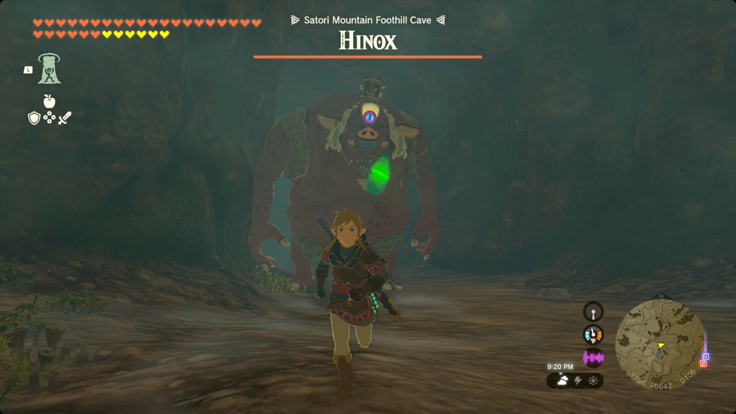 The Legend of Zelda: Tears of the Kingdom Link running away from a Hinox with the Usazum Shrine crystal around its neck inside Satori Mountain Foothill Cave