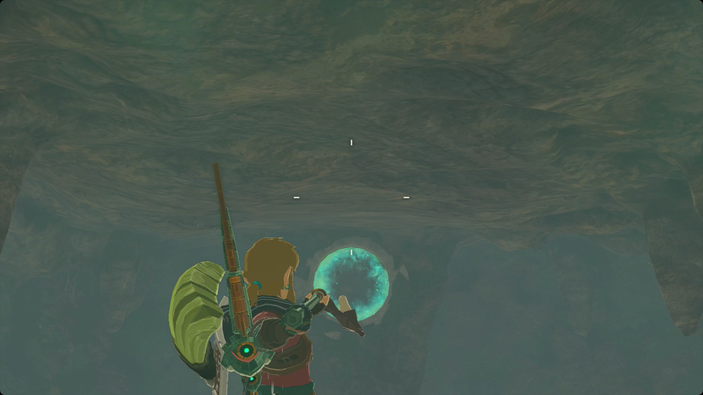 The Legend of Zelda: Tears of the Kingdom Link throwing a zonaite spear with a Fused Keese wing at the target in Tobio’s Hollow Cave to reveal Utojis Shrine.