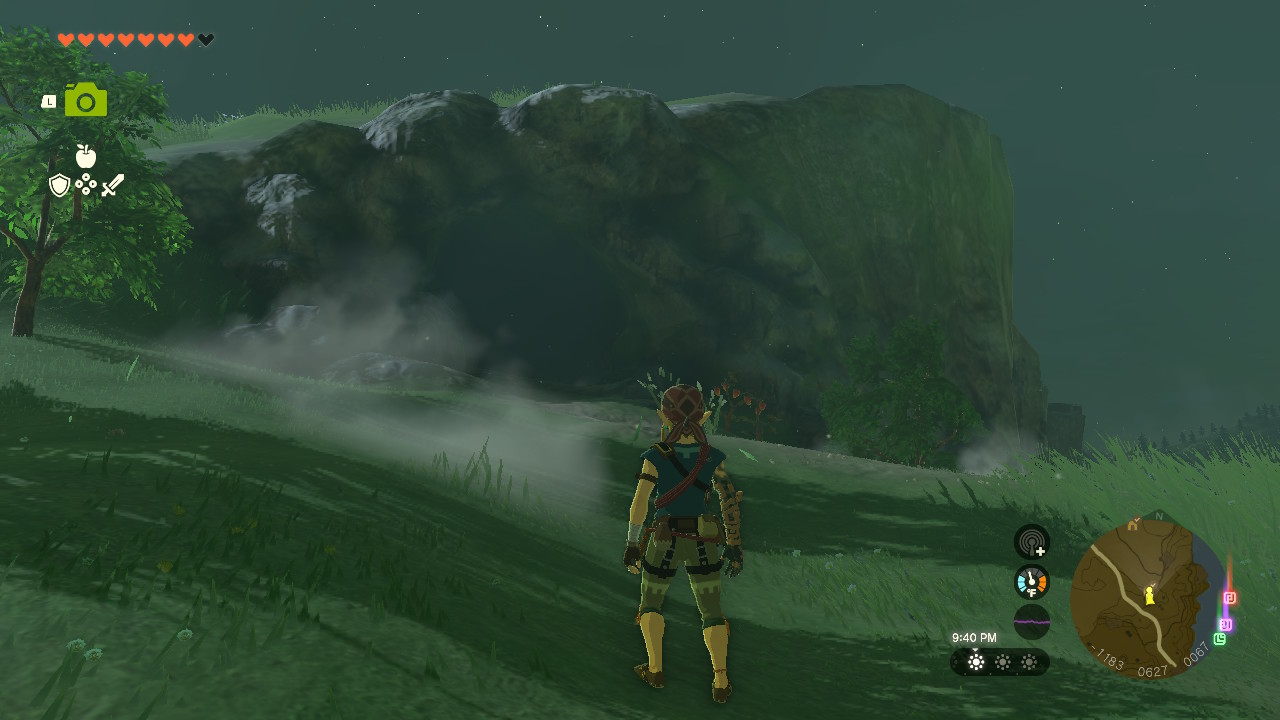 Link stands in front of the entrance to the North Hyrule Plain Cave, which is next to the main road to New Serenne Stable in Zelda: Tears of the Kingdom