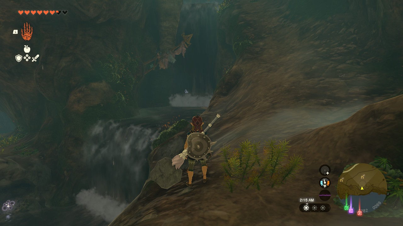 Link stands next to two waterfalls in Zelda: Tears of the Kingdom