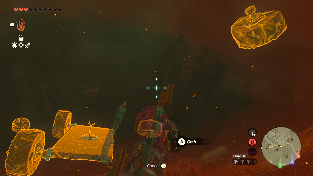 Link uses Ultrahand to grab the wheels and complete the Zonai construction in Zelda: Tears of the Kingdom
