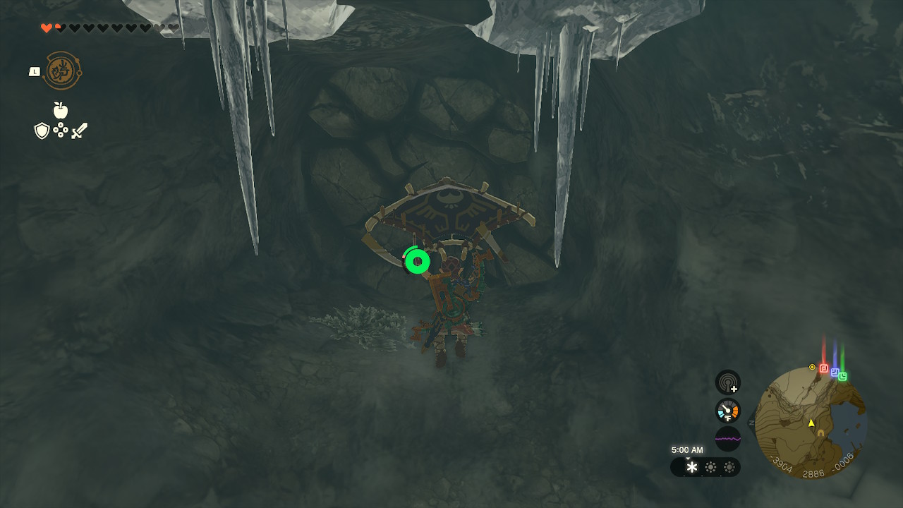 Link paraglides towards a rock wall in Zelda: Tears of the Kingdom