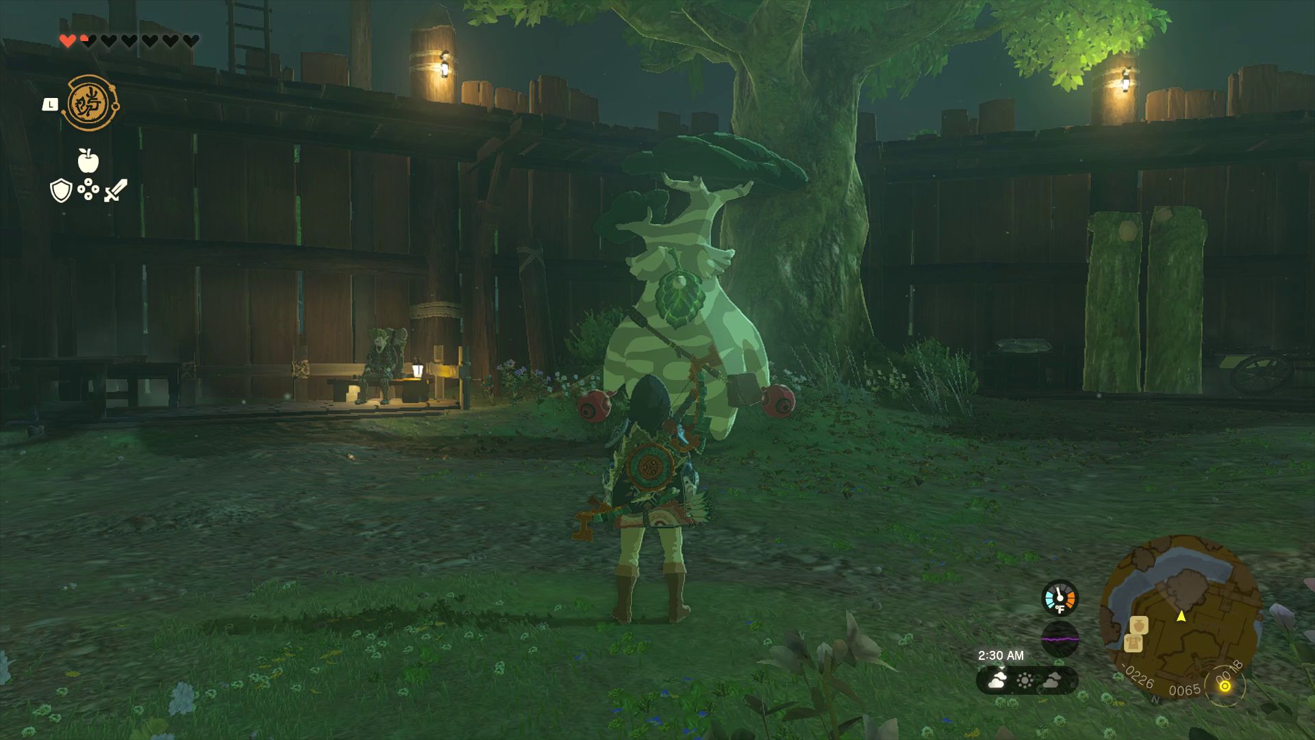 Link stands in front of Hestu, who’s chilling next to a tree inside Lookout Landing in Zelda: Tears of the Kingdom