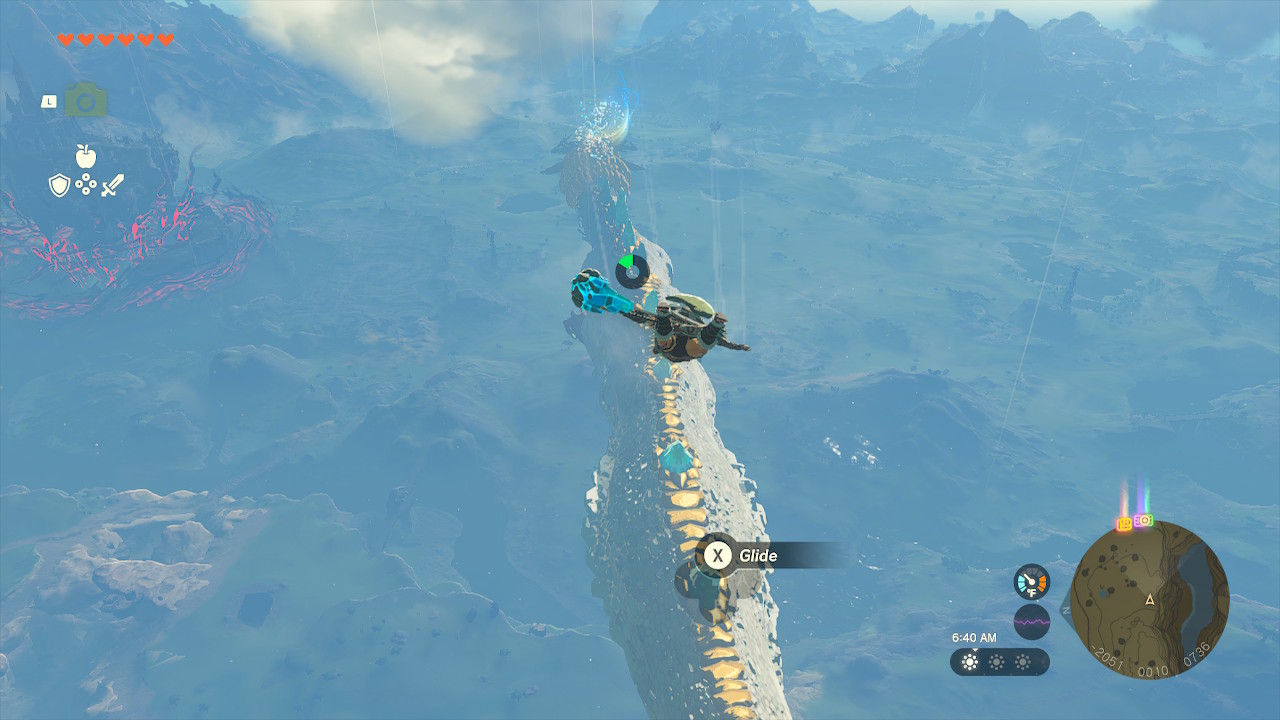 Link glides in the air and prepares to land on the back of the Light Dragon in Zelda: Tears of the Kingdom