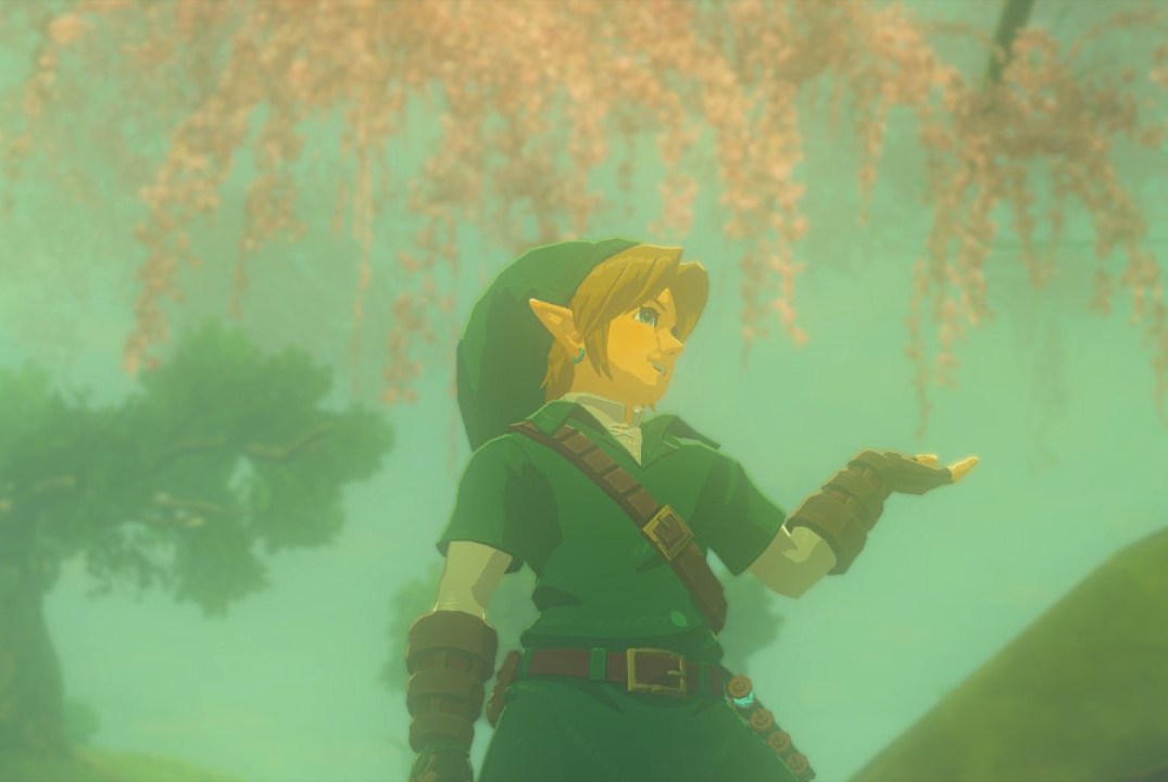 Link poses, lifting his left hand and smiling in the Korok Forest while wearing the Time Armor set in Zelda: Tears of the Kingdom