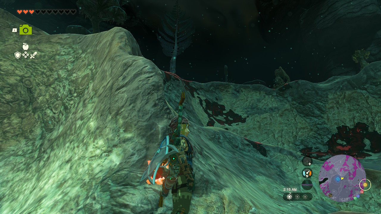 Link stands next to a hill inside the Depths in Zelda: Tears of the Kingdom