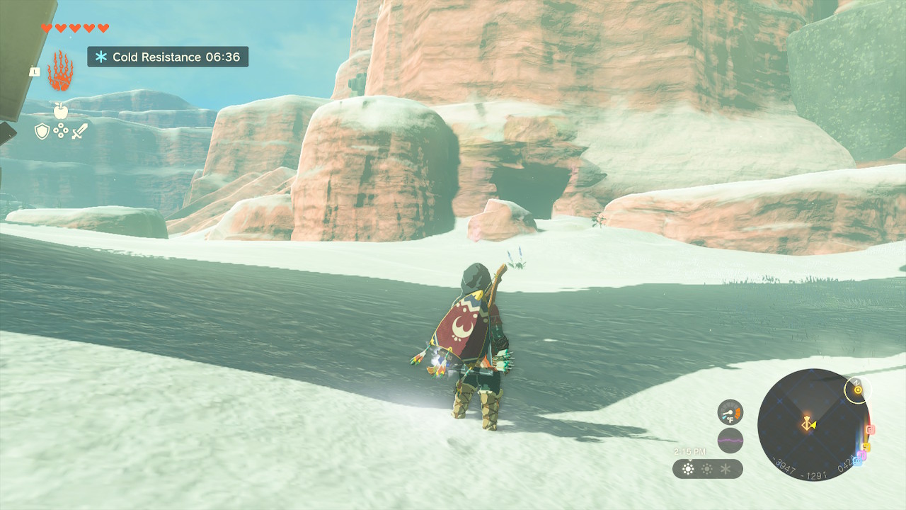 Link overlooks the snow covered entrance to Meadela’s Mantle Cave in Zelda: Tears of the Kingdom