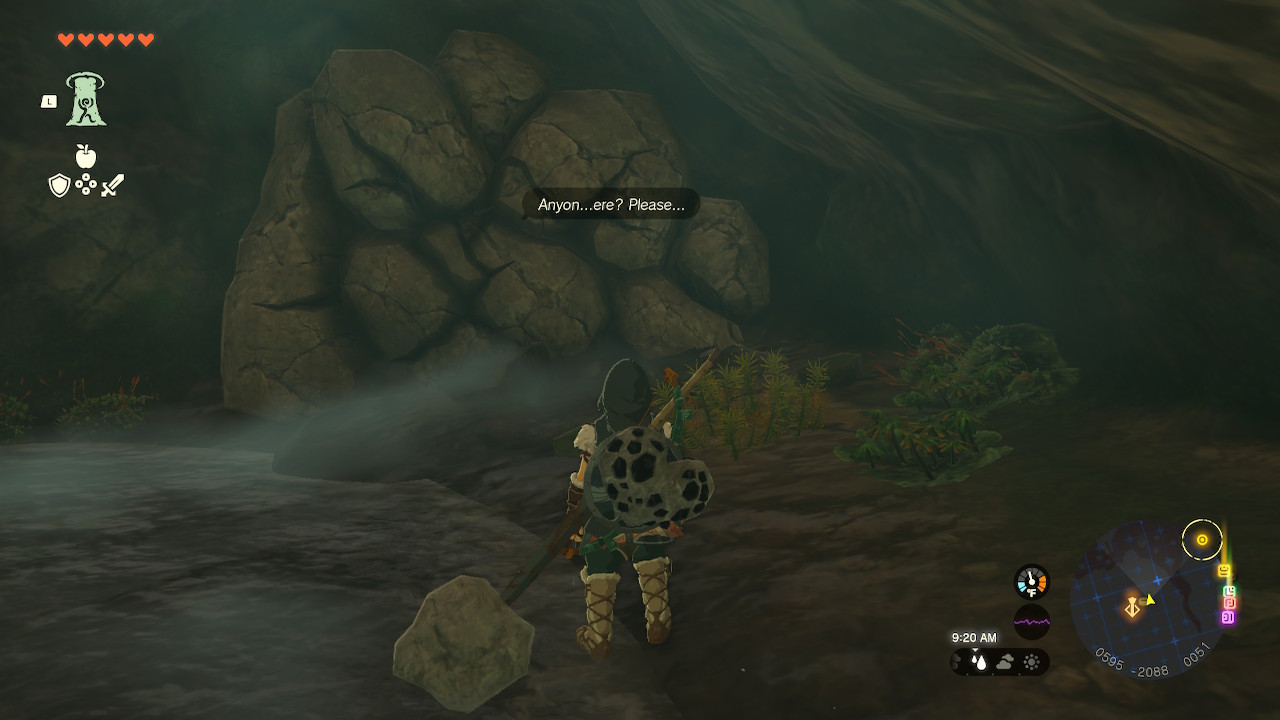 Link stands in front of a rock wall, and a voice on the other side asks, “Anyon...ere? Please...” in Zelda: Tears of the Kingdom