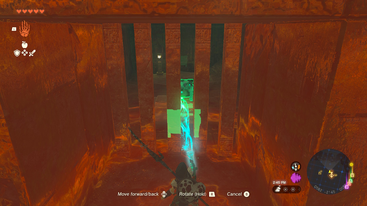 Link uses Ultrahand to move a chest on the other side of a cell in Zelda: Tears of the Kingdom