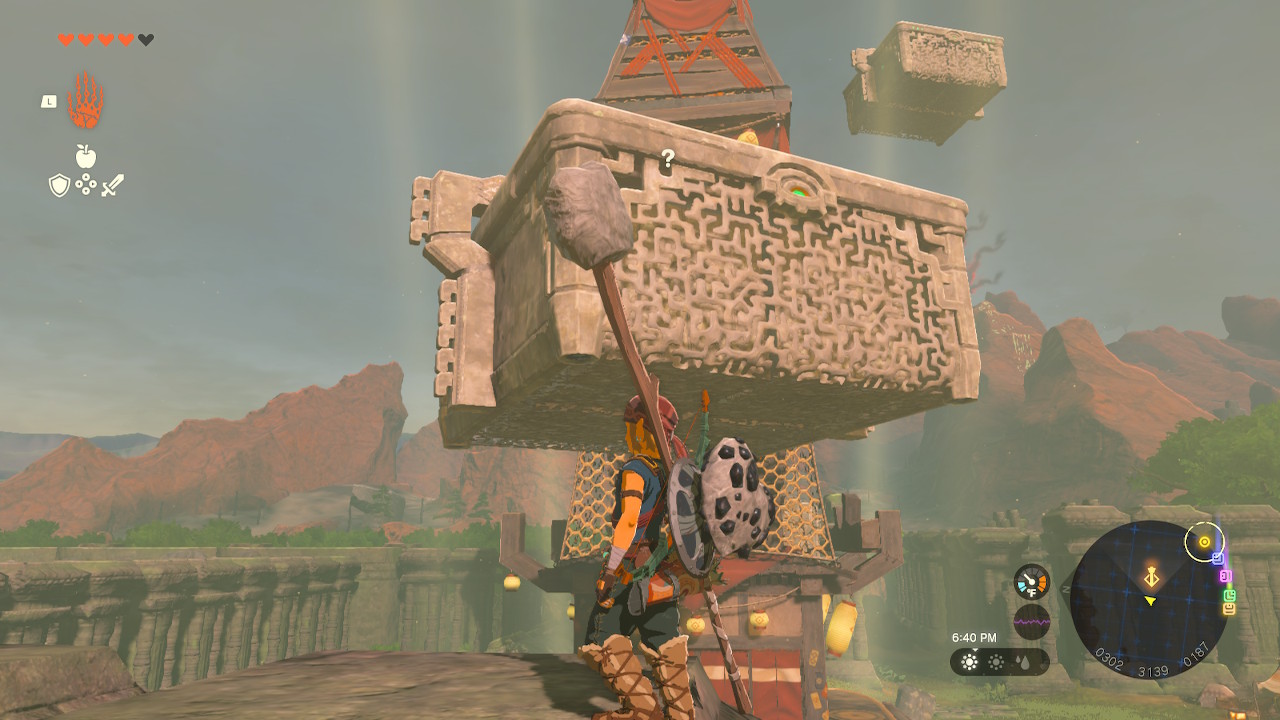 Link stands in front of a floating structure around the tower in Zelda: Tears of the Kingdom