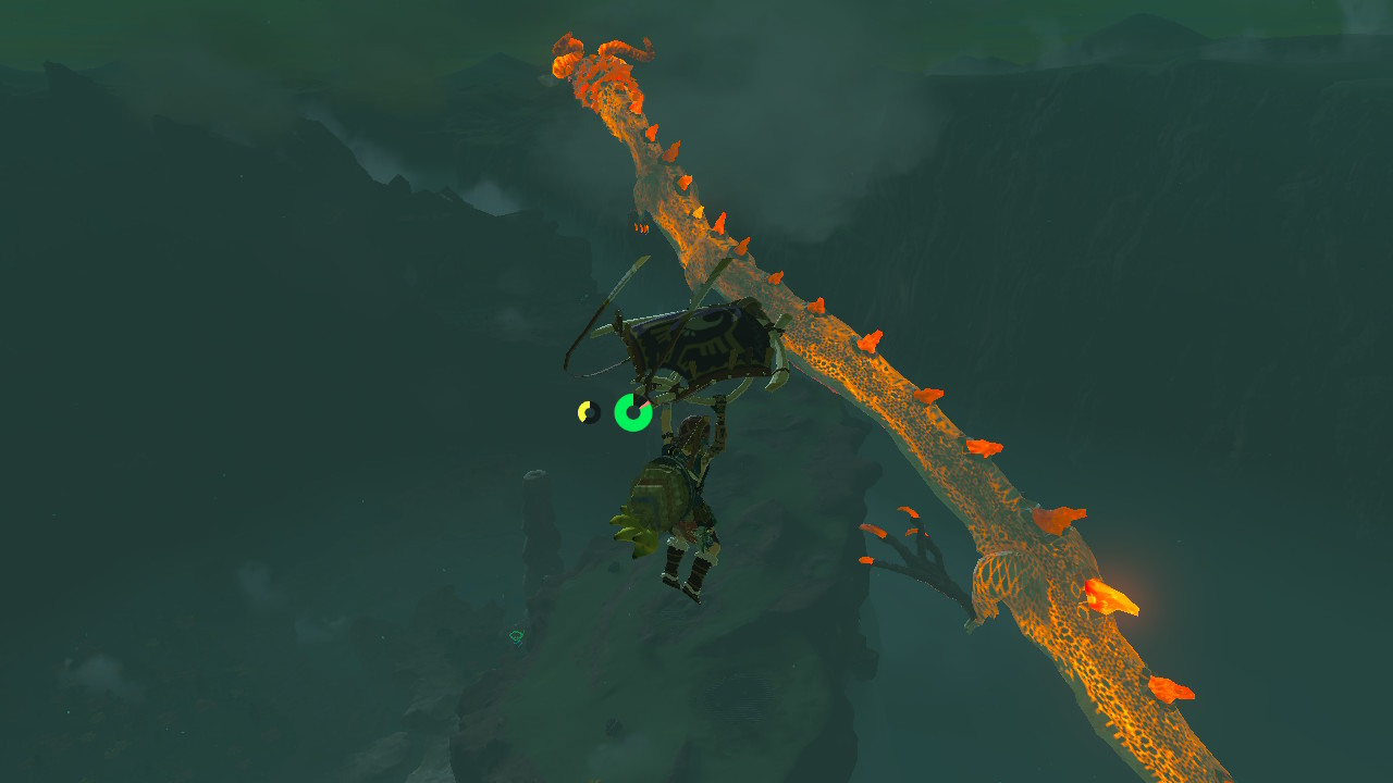 Link paraglides around Dinraal, one of the dragons in Zelda: Tears of the Kingdom