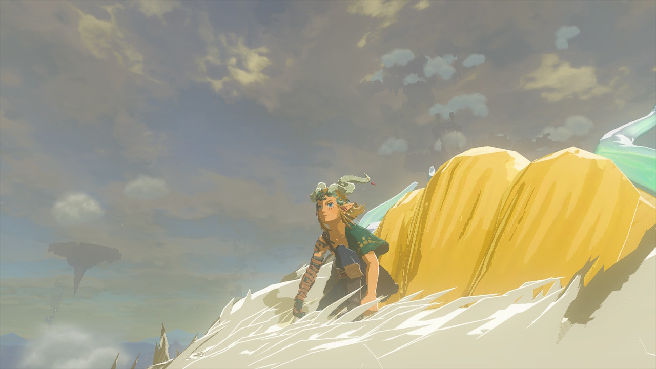 Link is crouched on top of the Light Dragon, wearing the Amber Armor head piece in Zelda: Tears of the Kingdom