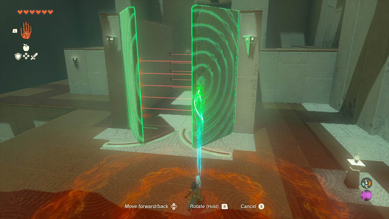 Link uses ultrahand to open a door in the Orochium Shrine in Zelda Tears of the Kingdom.