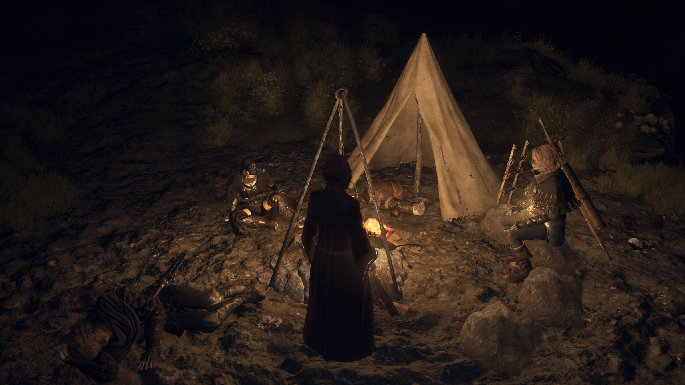 Characters sit around a camp fire and small tent in Dragon’s Dogma 2