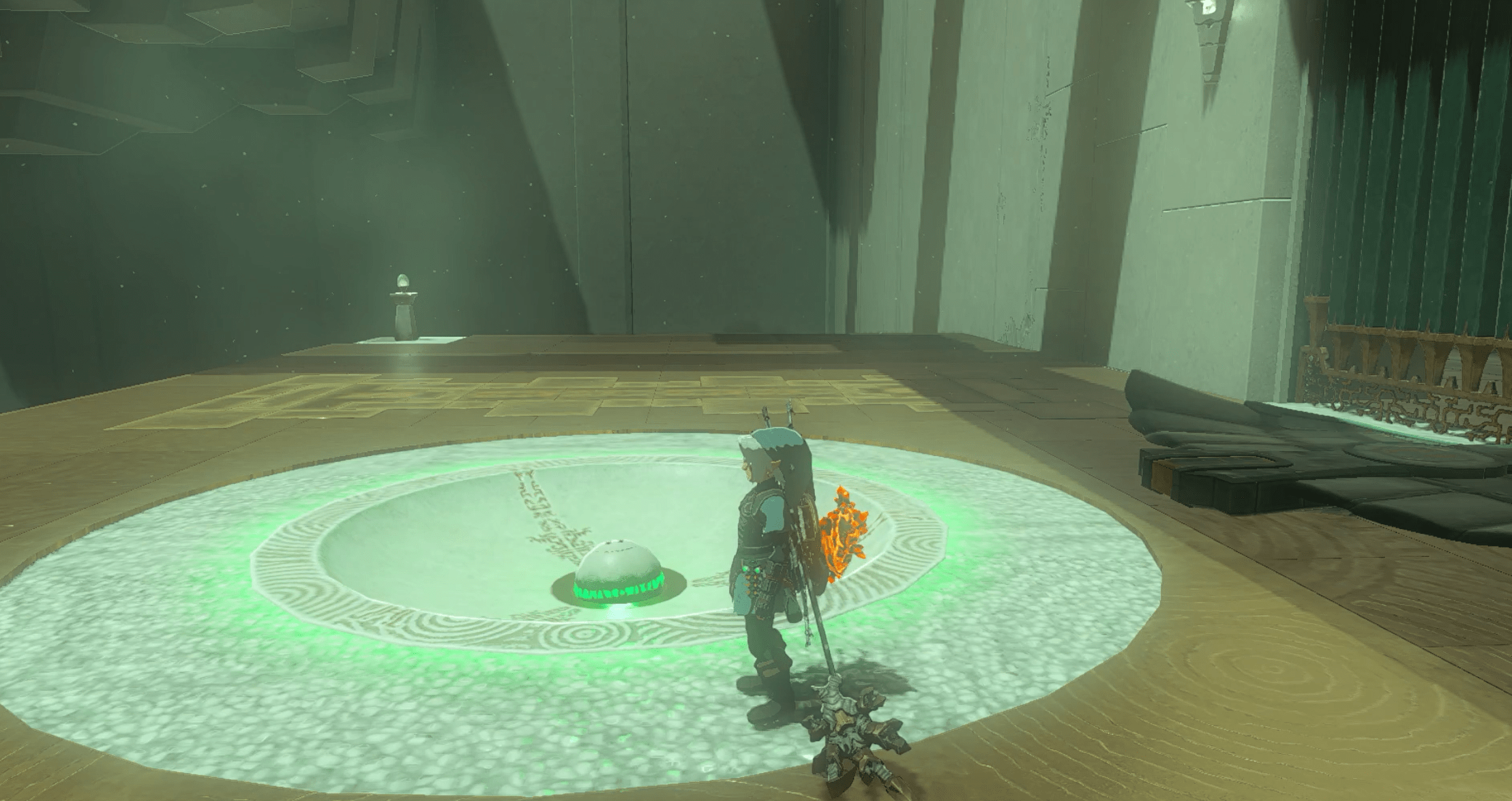 Link puts a ball in a divot in the floor in Zelda: Tears of the Kingdom