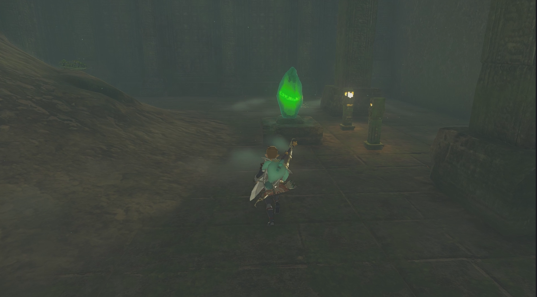 A small cave room containing a glowing green crystal in The Legend of Zelda: Tears of the Kingdom.