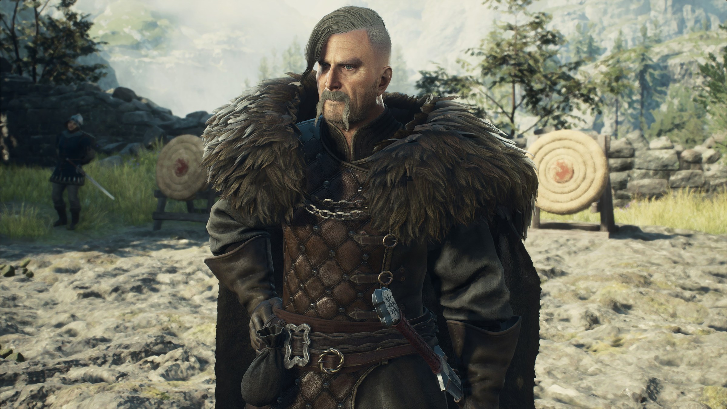 A figher maister and quest-giver stands in a green field in Dragon’s Dogma 2.