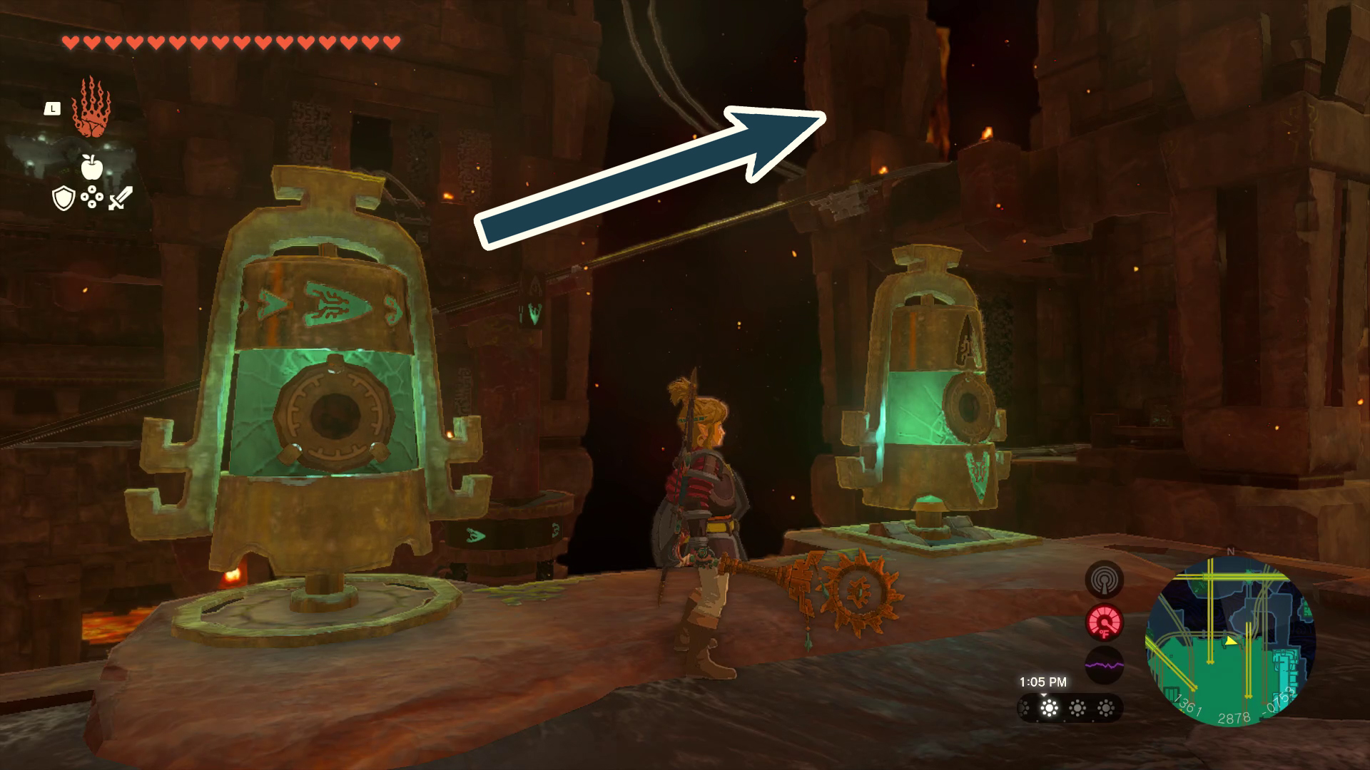 An arrow points a minecart track diagonally towards the top right in Tears of the Kingdom