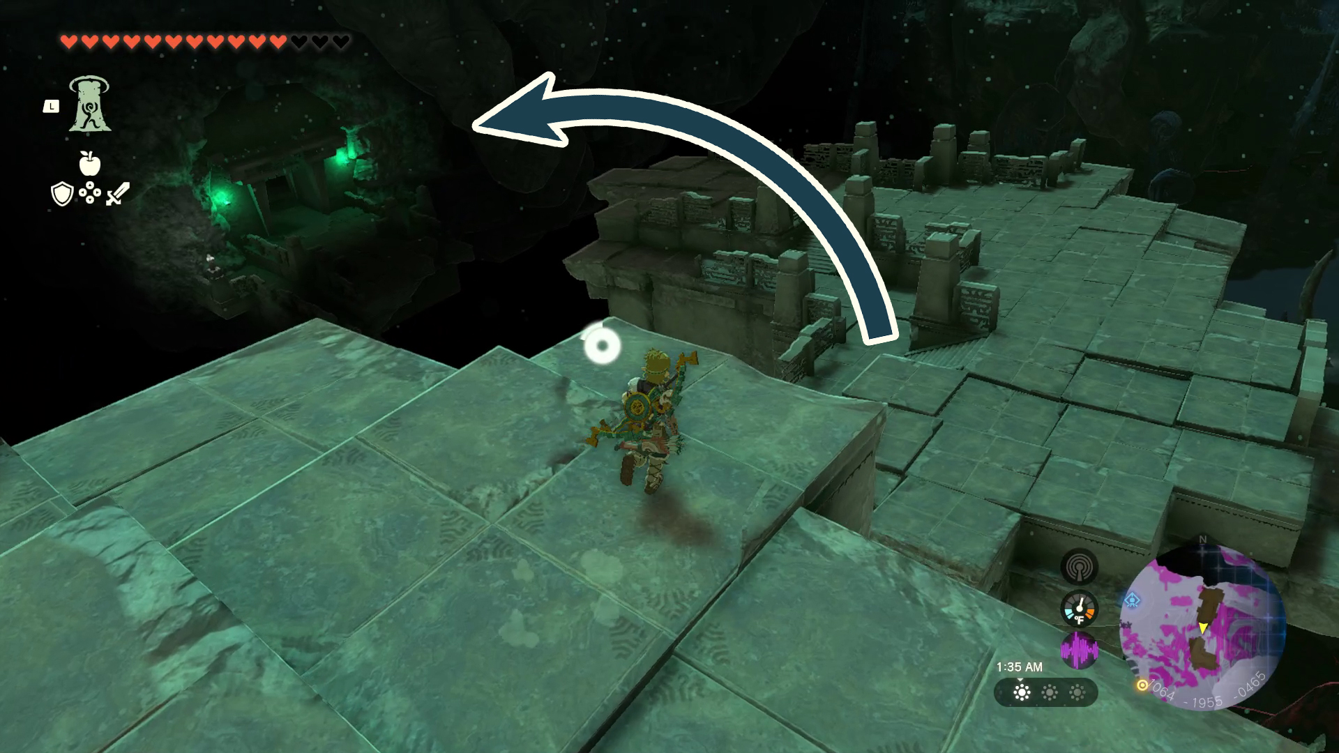 A dark teal arrow points Link around several bridges, towards a cavern entrance with green lanterns in Tears of the Kingdom