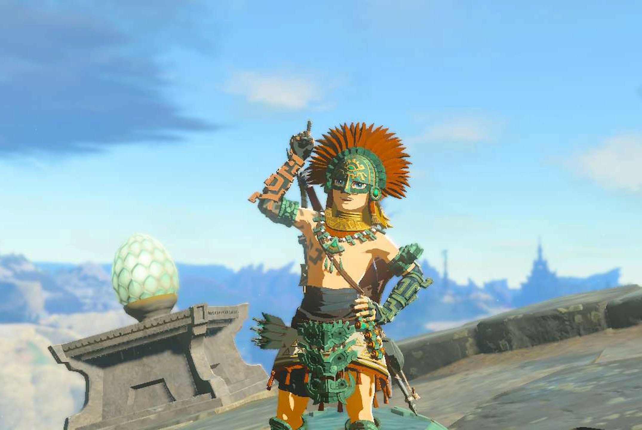 Link stands proudly wearing the Zonaite armor while pointing upwards in Zelda: Tears of the Kingdom