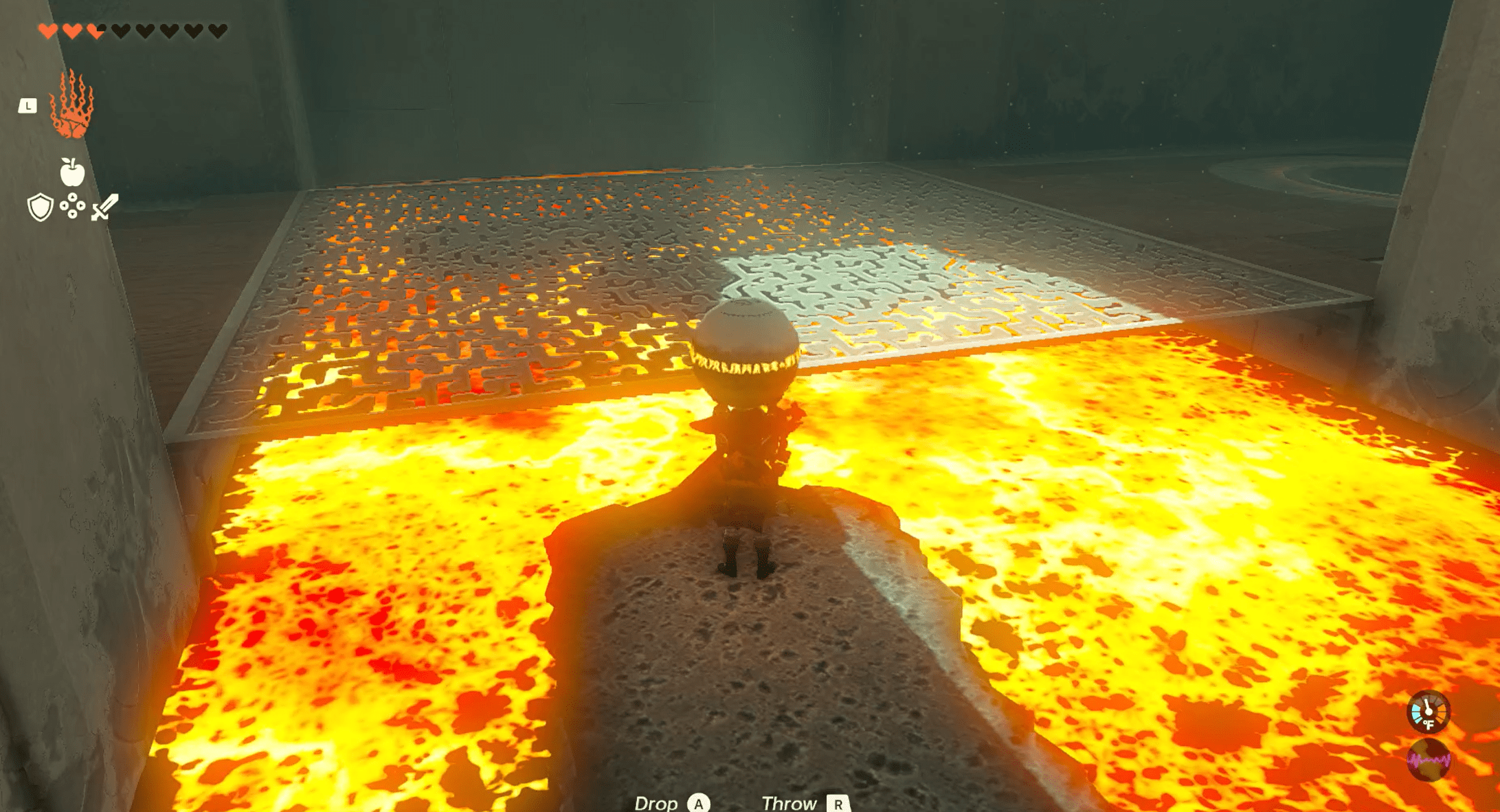Link riding a stone down a river of fire, holding a ball, in The Legend of Zelda: Tears of the Kingdom’s Timawak Shrine