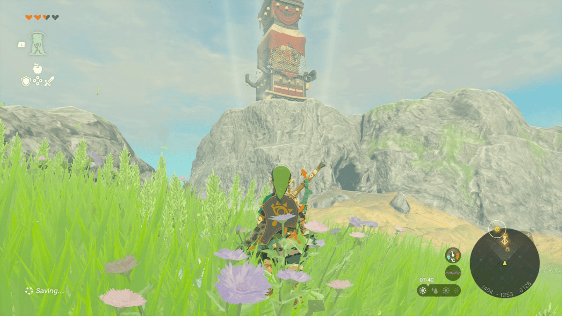 Link stands in front of a cave beneath Sahasra Slope Tower