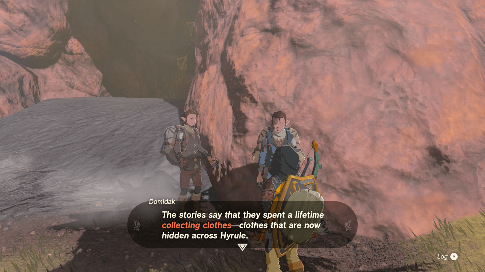 Link speaking with Domidak, with the text: “The stories say that they spent a lifetime collecting clothes — clothes that are now hidden across Hyrule.”