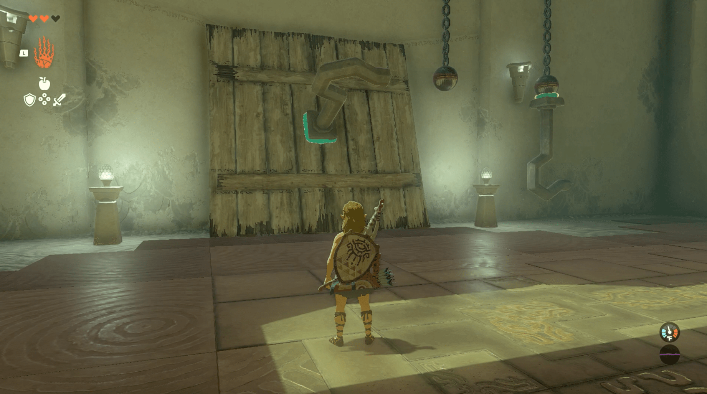 Link stares at a hook fused to a wooden slate in the Ukouh Shrine in Zelda Tears of the Kingdom.