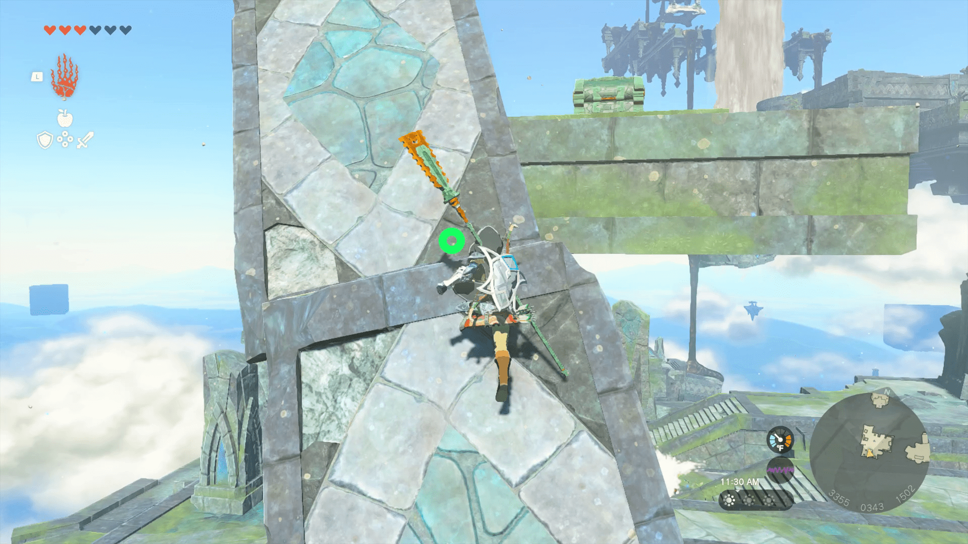 Link climbs up a blue and grey stone column. Halfway up the column, we see a mottled stone platform with a treasure chest perched on top.