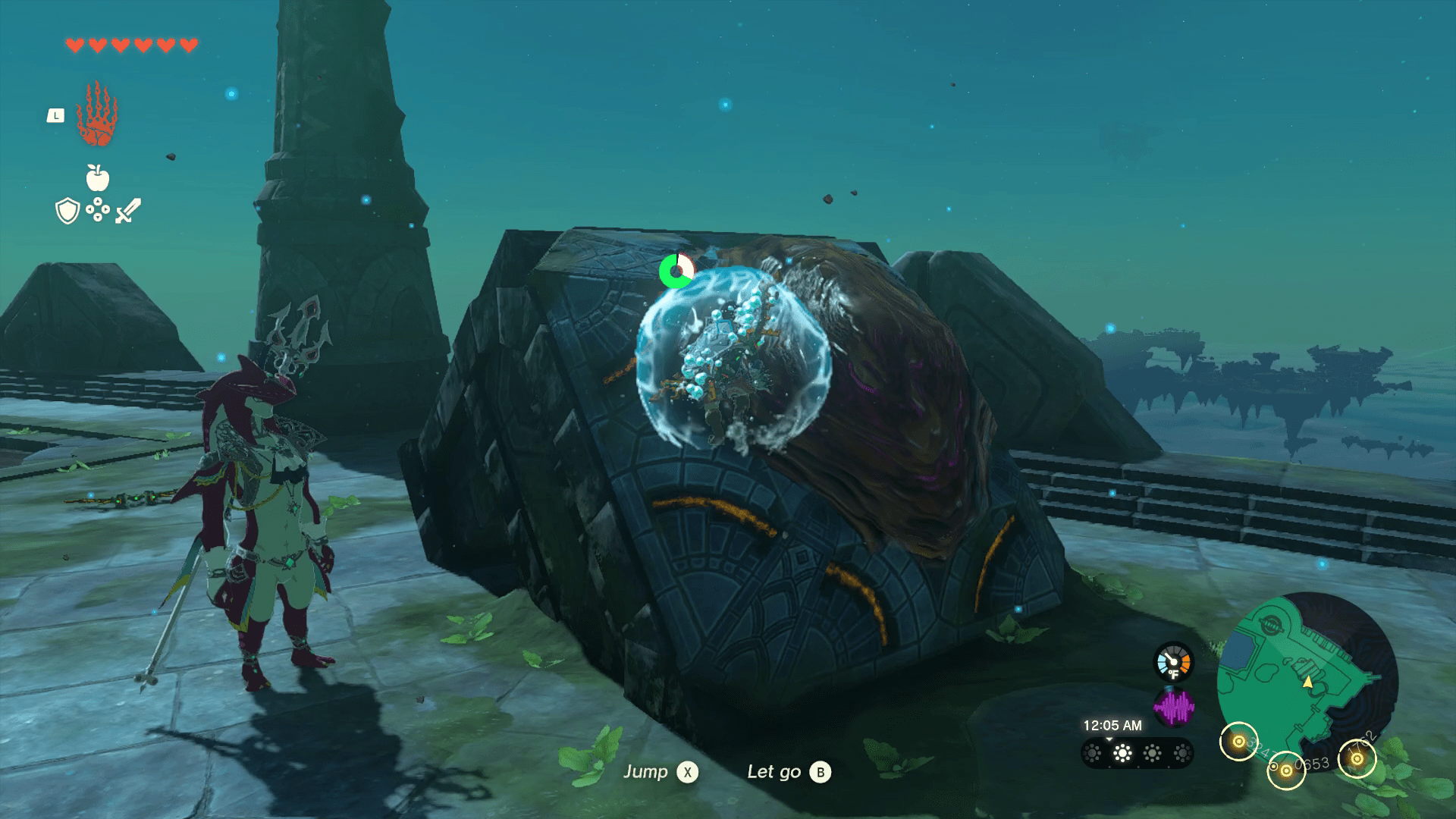 Sidon, a shark-man hybrid, stands next to a blue stone platform with a water spout covered in thick mud. Players must clean the mud to make an water bubble appear from the spout.