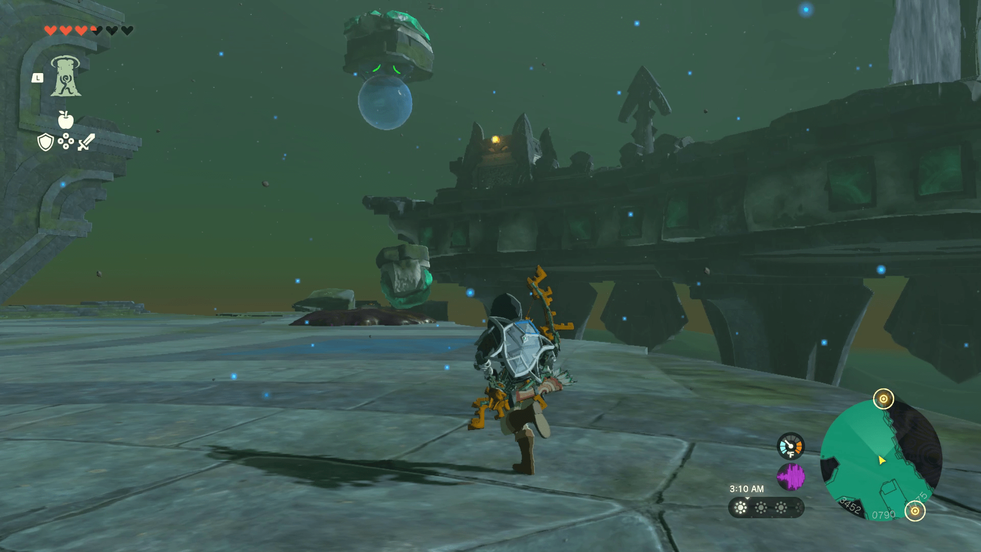 Link runs across an open area towards a pile of mud with a rock and spout sticking out of it. In the distance, a water bubble pushes a platform upward.